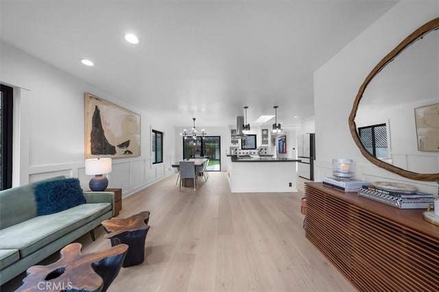1012 10th St, Manhattan Beach, CA 90266 - living room featuring a chandelier, light wood-style floors, and recessed lighting