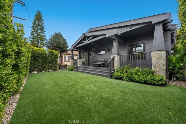 1012 10th St, Manhattan Beach, CA 90266 - back of house with a lawn and covered porch