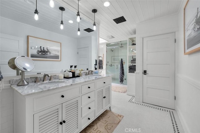 1012 10th St, Manhattan Beach, CA 90266 - bathroom featuring double vanity, a stall shower, wood ceiling, a wainscoted wall, and crown molding