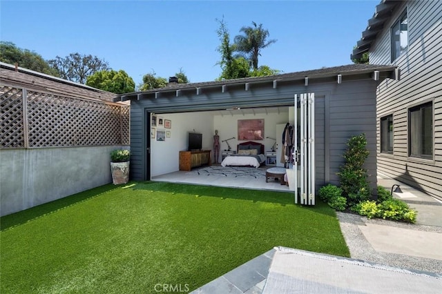 1012 10th St, Manhattan Beach, CA 90266 - back of property with a yard, an outbuilding, and a patio area