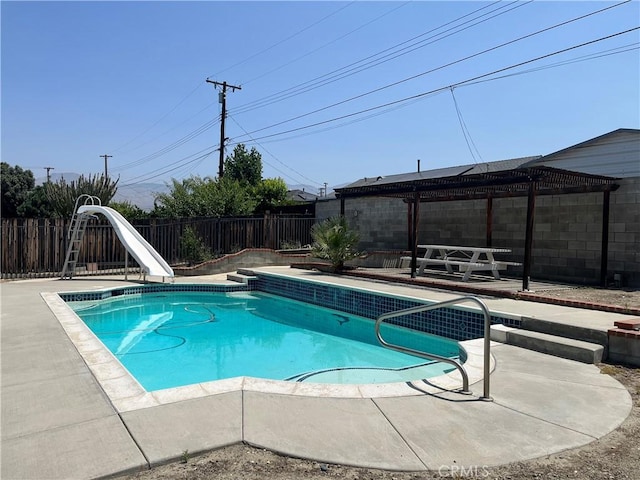 1424 Hunter Dr, Redlands, CA 92374 - view of pool featuring a water slide, a pergola, a fenced backyard, and a patio area
