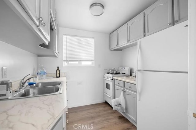10224 Fernglen Ave, Tujunga, CA 91042 - kitchen featuring white appliances and light wood-type flooring