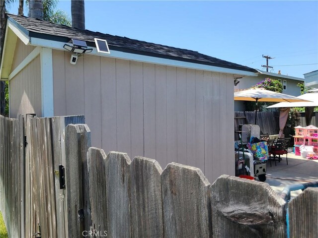 1548 N Elm Ave, Costa Mesa, CA 92626 - view of property exterior with a patio area and roof with shingles