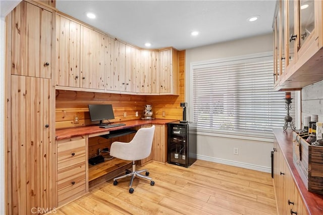 10270 Durango River Ct, Fountain Valley, CA 92708 - home office featuring beverage cooler, built in desk, light wood-type flooring, and recessed lighting