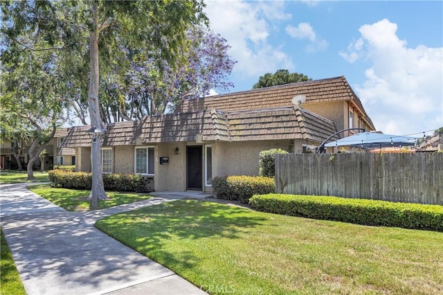 10270 Durango River Ct, Fountain Valley, CA 92708 - view of front of property with mansard roof and stucco siding