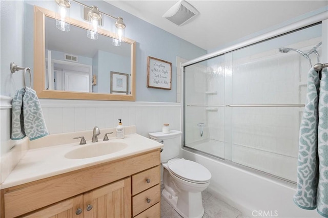 10270 Durango River Ct, Fountain Valley, CA 92708 - full bath with vanity, shower / bath combination with glass door, and wainscoting