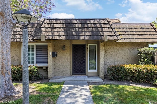 10270 Durango River Ct, Fountain Valley, CA 92708 - entrance to property with stucco siding and mansard roof