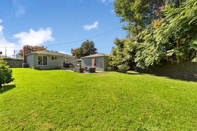 213 E 45th St, Long Beach, CA 90807 - fenced backyard featuring a patio area and an outdoor hangout area