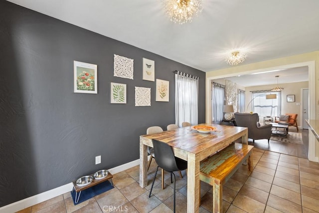 213 E 45th St, Long Beach, CA 90807 - dining area featuring a chandelier and light tile patterned floors