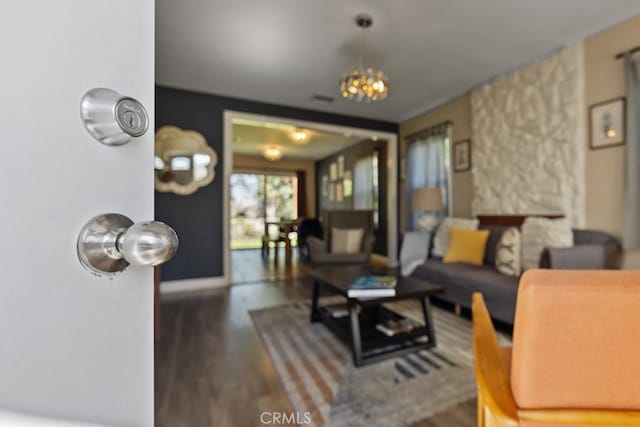 213 E 45th St, Long Beach, CA 90807 - living area with wood finished floors and a chandelier