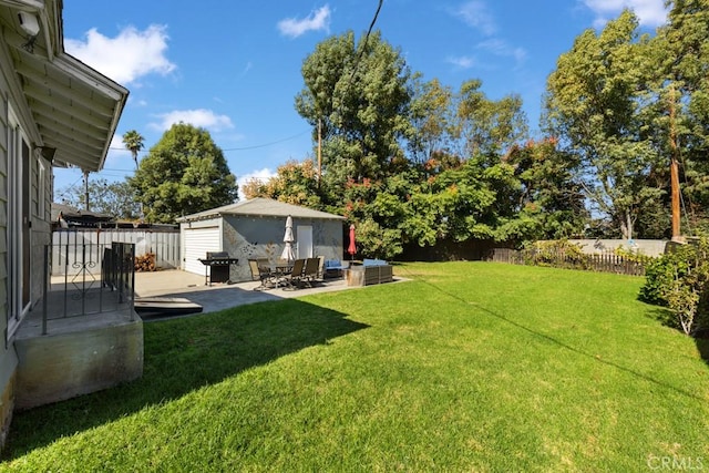 213 E 45th St, Long Beach, CA 90807 - fenced backyard featuring a patio, an outdoor hangout area, and an outdoor structure