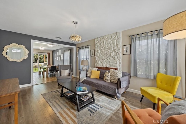213 E 45th St, Long Beach, CA 90807 - living room with a chandelier and wood finished floors