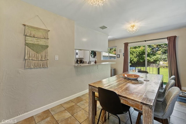 213 E 45th St, Long Beach, CA 90807 - dining area with baseboards and a chandelier