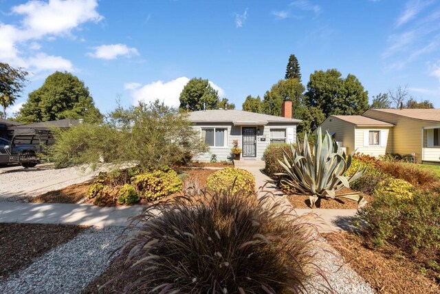 213 E 45th St, Long Beach, CA 90807 - view of front facade featuring a chimney