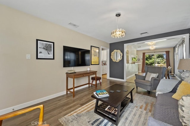 213 E 45th St, Long Beach, CA 90807 - living room with a chandelier and wood finished floors