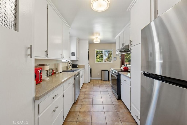 213 E 45th St, Long Beach, CA 90807 - kitchen featuring appliances with stainless steel finishes, separate washer and dryer, light countertops, and white cabinetry