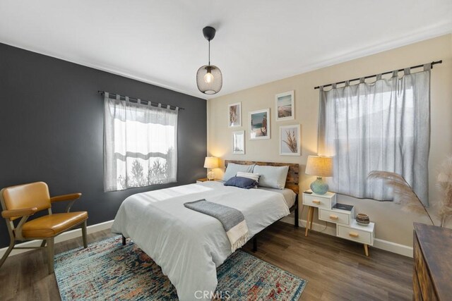 213 E 45th St, Long Beach, CA 90807 - bedroom with baseboards and wood finished floors