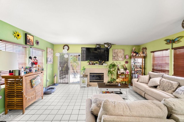 14134 Orizaba Ave, Paramount, CA 90723 - living room featuring light tile patterned flooring and a tile fireplace
