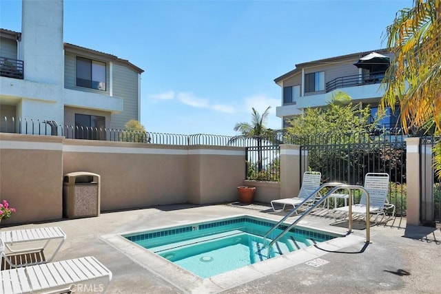 260 Cagney Ln Unit 206, Newport Beach, CA 92663 - view of swimming pool featuring a hot tub and a patio area