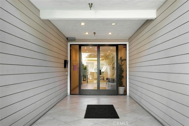 260 Cagney Ln Unit 206, Newport Beach, CA 92663 - view of exterior entry featuring a patio area