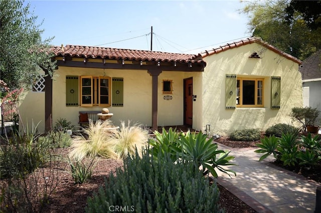 413 W Santa Clara Ave, Santa Ana, CA 92706 - mediterranean / spanish-style house with stucco siding and a tile roof