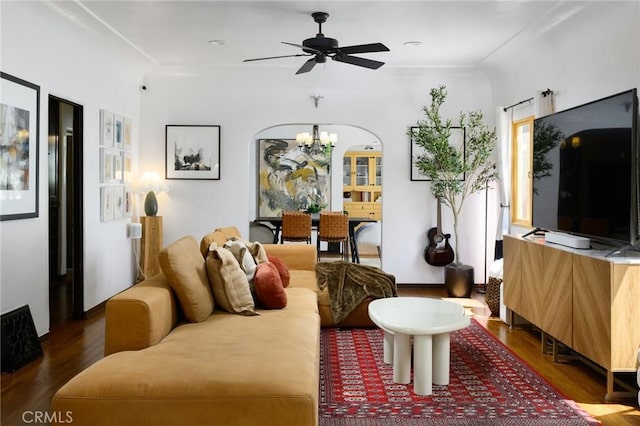413 W Santa Clara Ave, Santa Ana, CA 92706 - living room with wood finished floors, ceiling fan, a chandelier, and arched walkways