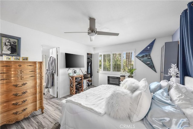 2455 Via Sonoma Unit A, Palm Springs, CA 92264 - bedroom with light wood finished floors and ceiling fan