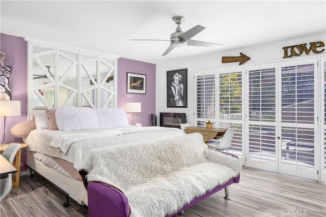2455 Via Sonoma Unit A, Palm Springs, CA 92264 - bedroom with wood finished floors, access to outside, and a ceiling fan