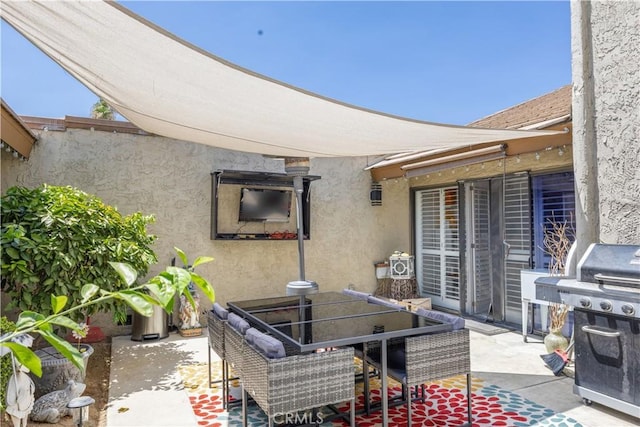 2455 Via Sonoma Unit A, Palm Springs, CA 92264 - view of patio / terrace with a grill and outdoor dining space