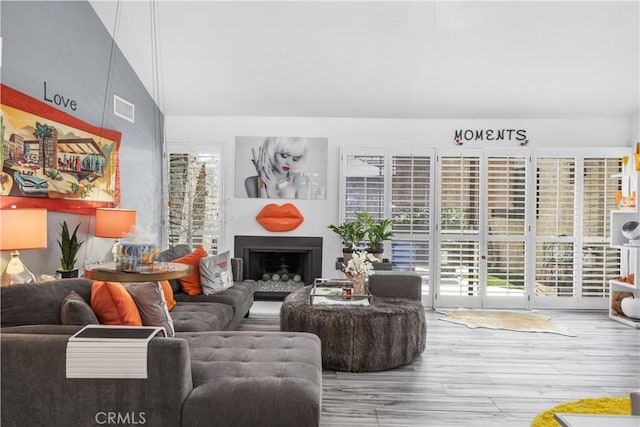 2455 Via Sonoma Unit A, Palm Springs, CA 92264 - living room featuring wood finished floors and a fireplace