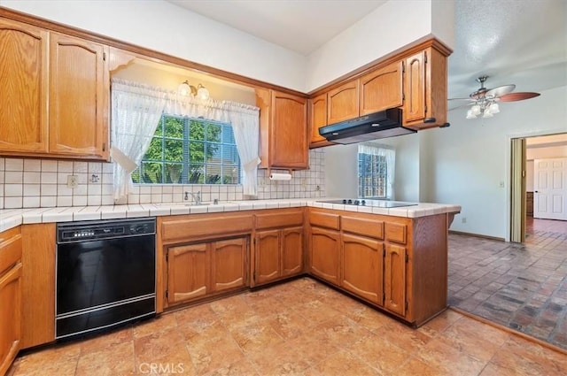 29801 Maxine Ln, Menifee, CA 92584 - kitchen with black appliances, under cabinet range hood, ceiling fan, tasteful backsplash, and a peninsula
