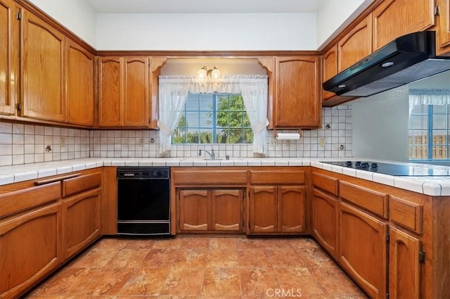 29801 Maxine Ln, Menifee, CA 92584 - kitchen featuring black appliances, ventilation hood, brown cabinetry, and decorative backsplash