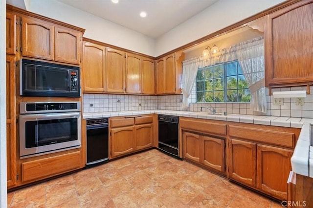 29801 Maxine Ln, Menifee, CA 92584 - kitchen featuring black appliances, tasteful backsplash, brown cabinetry, and recessed lighting