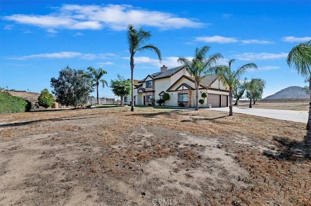 29801 Maxine Ln, Menifee, CA 92584 - view of front of house with a garage, solar panels, and driveway