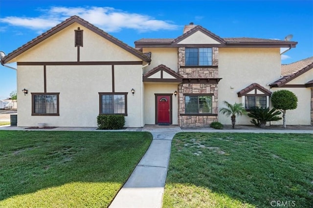 29801 Maxine Ln, Menifee, CA 92584 - english style home featuring a front yard, stucco siding, stone siding, and a tiled roof