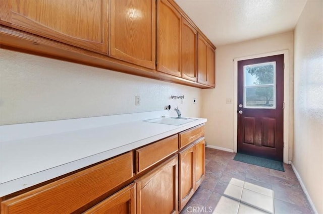 29801 Maxine Ln, Menifee, CA 92584 - laundry room featuring cabinet space, washer hookup, and light tile patterned floors