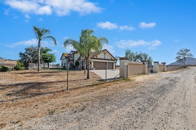 29801 Maxine Ln, Menifee, CA 92584 - view of front of house with a garage, concrete driveway, and stucco siding