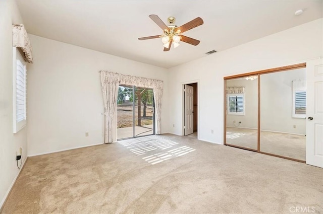 29801 Maxine Ln, Menifee, CA 92584 - unfurnished bedroom with carpet floors, access to exterior, and a ceiling fan