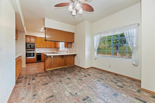 29801 Maxine Ln, Menifee, CA 92584 - kitchen with built in microwave, oven, a peninsula, brick flooring, and backsplash