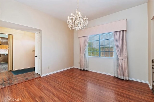 29801 Maxine Ln, Menifee, CA 92584 - spare room with a chandelier and wood finished floors