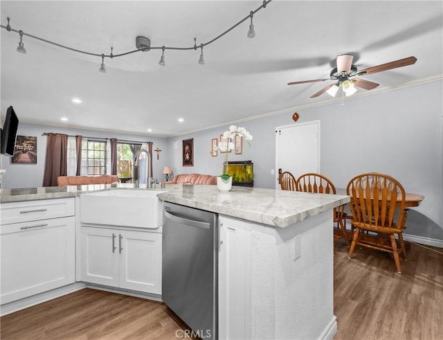 3611 S Bear St Unit D, Santa Ana, CA 92704 - kitchen with stainless steel dishwasher, light wood finished floors, a ceiling fan, white cabinetry, and recessed lighting