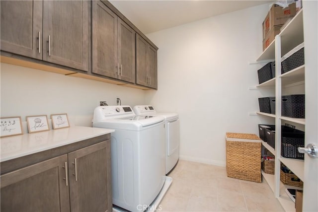 11534 Alana Ln, Beaumont, CA 92223 - laundry area with cabinet space, washing machine and dryer, and light tile patterned flooring