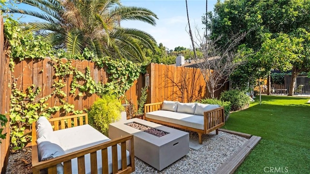 3209 Bennett Dr, Los Angeles, CA 90068 - fenced backyard featuring an outdoor living space with a fire pit and a patio area