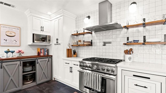 3209 Bennett Dr, Los Angeles, CA 90068 - kitchen with appliances with stainless steel finishes, wall chimney range hood, open shelves, and light countertops