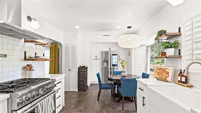 3209 Bennett Dr, Los Angeles, CA 90068 - kitchen featuring open shelves, stainless steel appliances, light countertops, decorative backsplash, and white cabinets