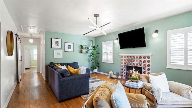 3209 Bennett Dr, Los Angeles, CA 90068 - living area with attic access, a fireplace, and wood finished floors