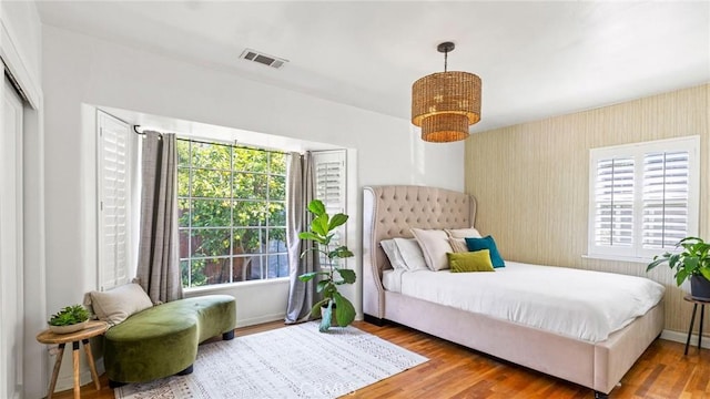 3209 Bennett Dr, Los Angeles, CA 90068 - bedroom featuring wood finished floors, wallpapered walls, and a closet