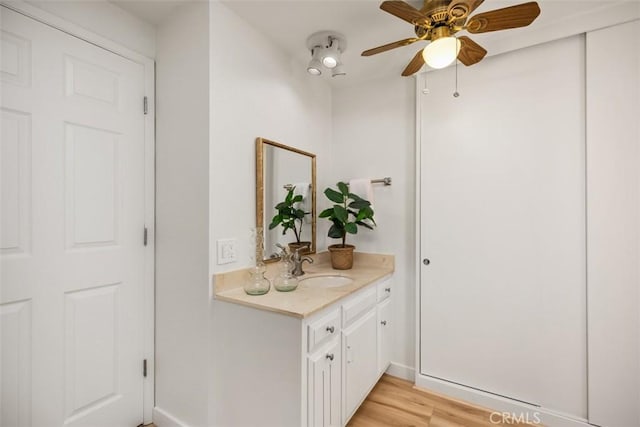 933 Avenida Majorca Unit P, Laguna Woods, CA 92637 - bathroom with vanity, ceiling fan, and wood finished floors