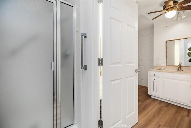 933 Avenida Majorca Unit P, Laguna Woods, CA 92637 - full bathroom with a shower stall, vanity, and wood finished floors