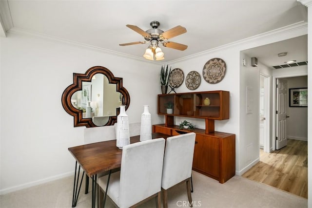 933 Avenida Majorca Unit P, Laguna Woods, CA 92637 - dining space featuring crown molding, ceiling fan, and light carpet